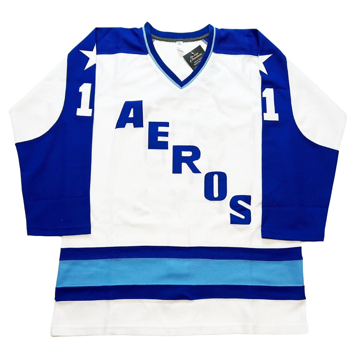 1972 Houston Aeros jersey white with royal blue sleeves. Light blue and royal trim on waist. Aeros diagonal top left to bottom right Royal Retros