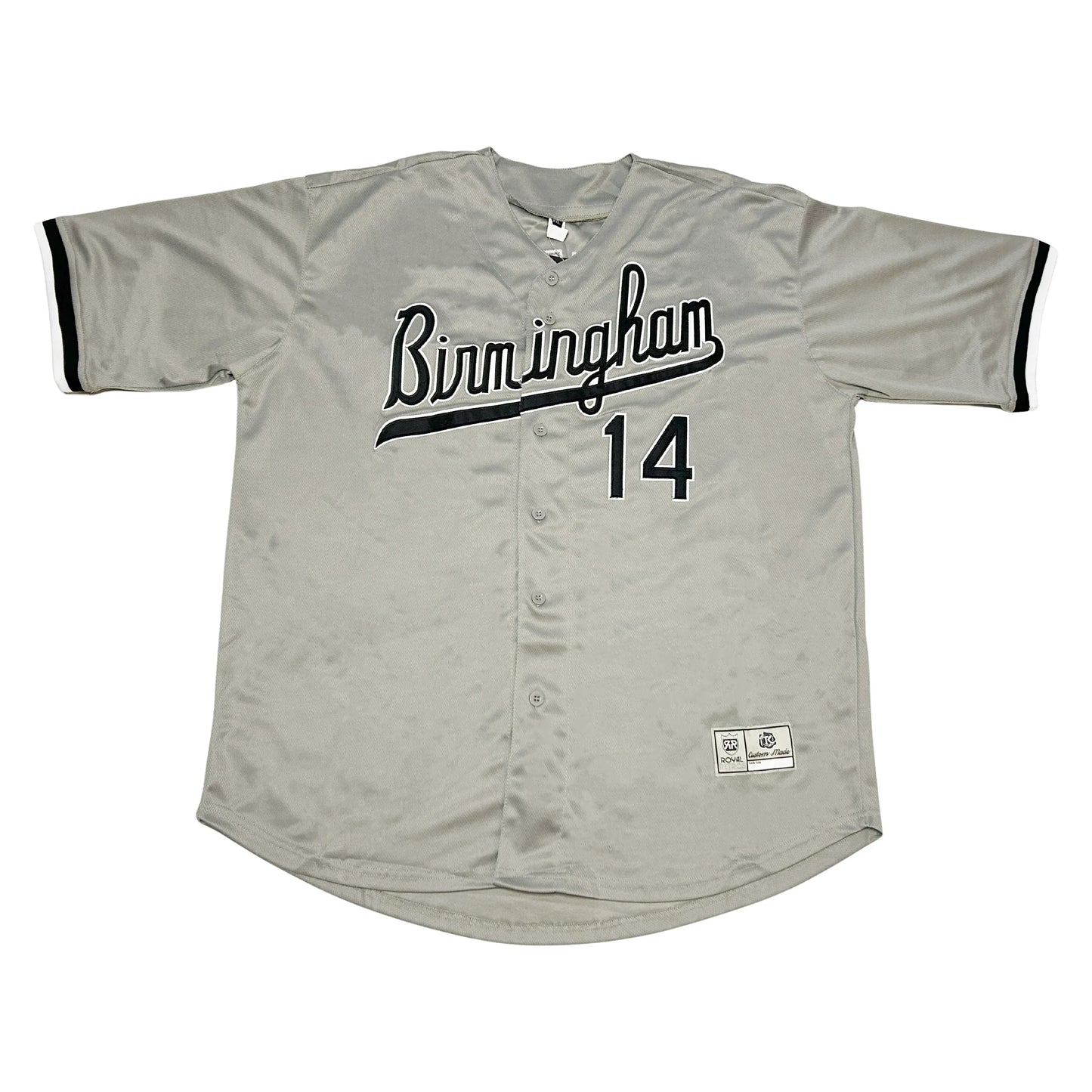 Birmingham Barons button-up baseball jersey. Gray. BIRMINGHAM in cursive, black with white trim and text tail coming off M. #14 lower right, black with white trim. Black trim on sleeve ends. Royal Retros
