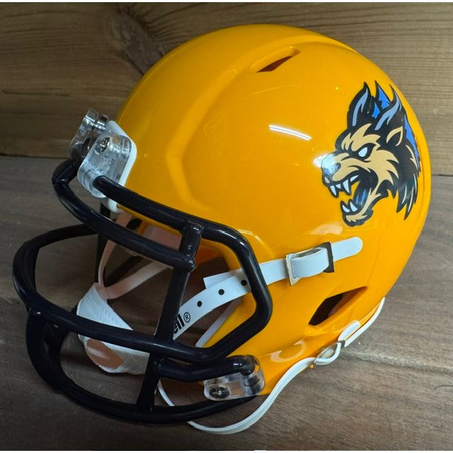 Minnesota Monsters Mini Helmet. Gold shell with a navy facemask. Snarling wolf-monster head logo on the side in gold and navy with red eyes and white fangs.