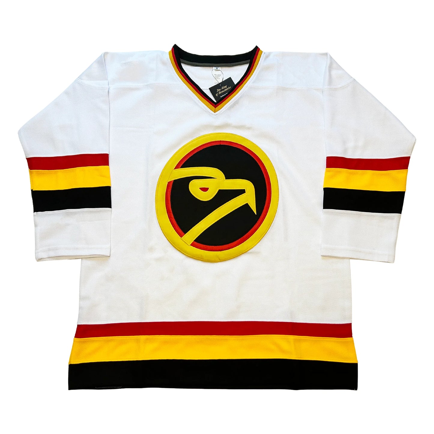Louisville Icehawks hockey jersey white. Black, red, and gold collar. Red, gold, and black bands, mid-sleeve and around waist. Logo is stylized hawk head in gold circle, with red trim inside and black background. Head is gold with red eye. Royal Retros