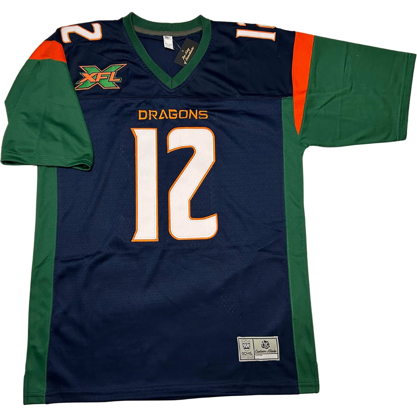 Seattle Sea Dragons jersey. Blue with green sleeves and sides. Orange trim at shoulders. Green trim on neck. White #12 with orange trim large on chest, small on shoulders. Royal Retros.