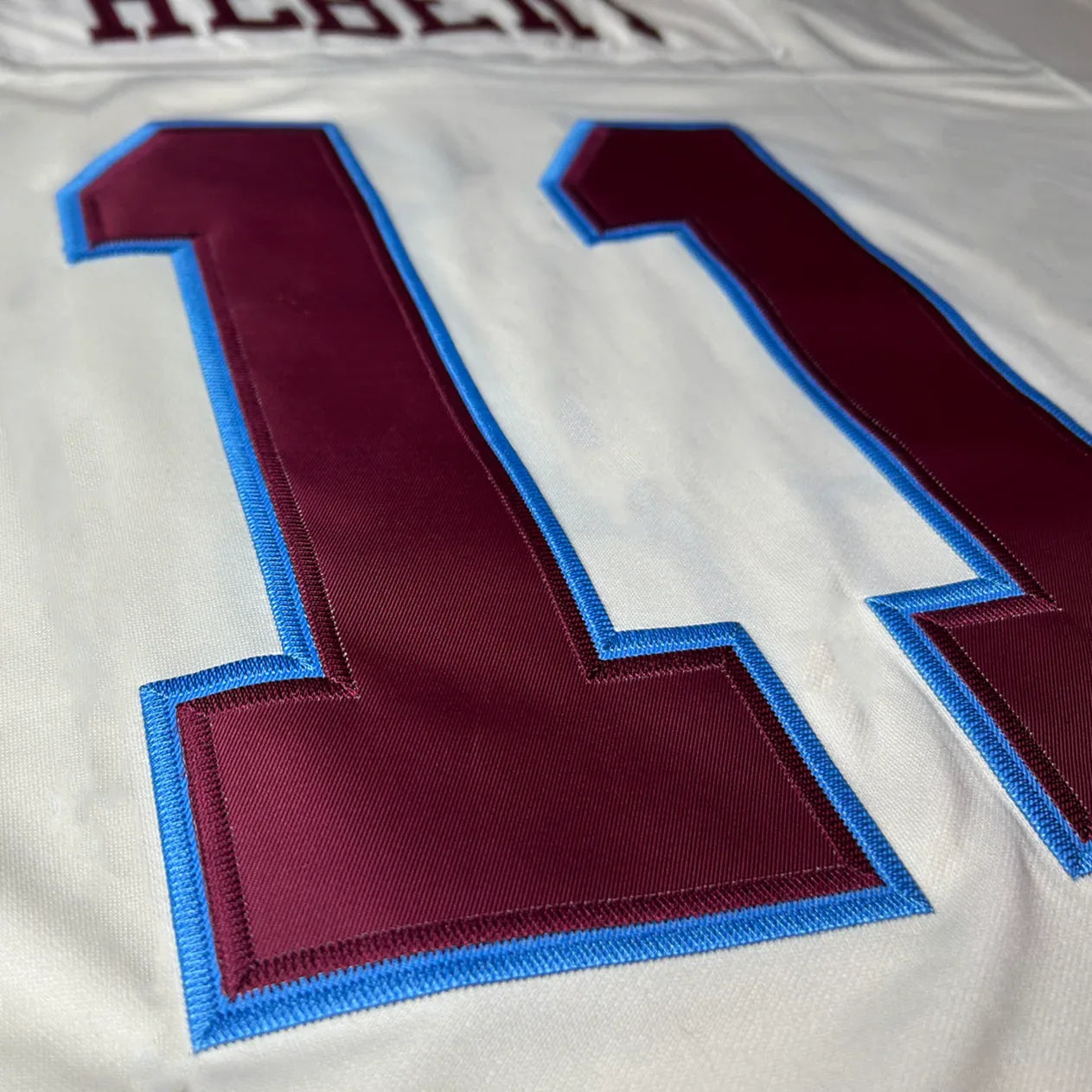 Michigan Panthers Cream Collection USFL Jersey up close #11 Royal Retros