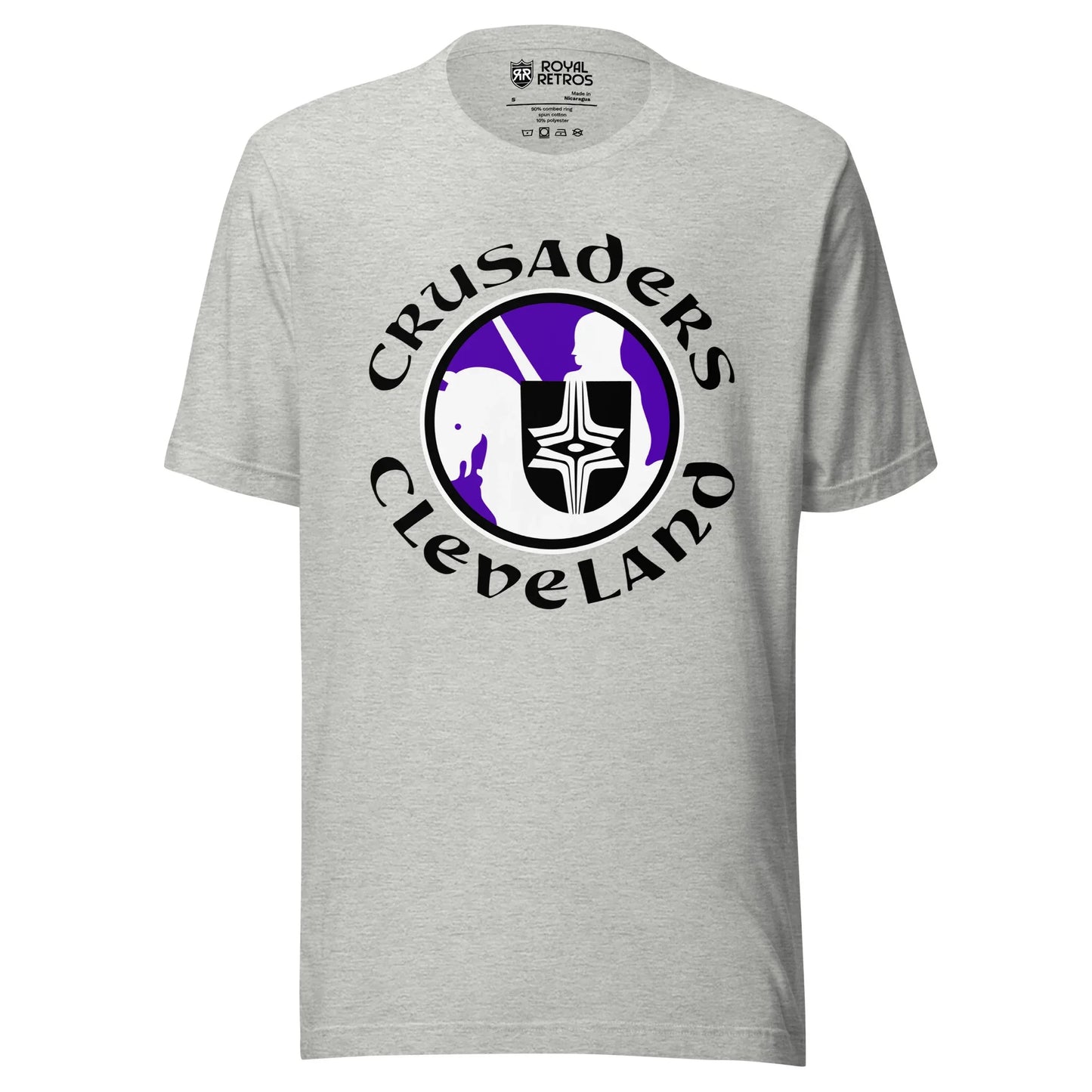 Cleveland Crusaders WHA T-shirt. Light Gray. Logo on chest: White circle with purple background with stylized knight on horse with black shield with white cross design. Horse is facing left. Crusaders in black curved over top of circle, Cleveland in black arched below. Royal Retros