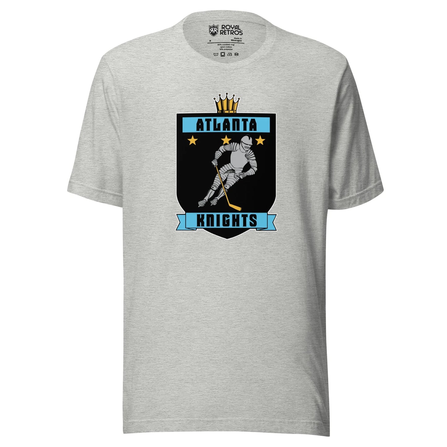 Atlanta Knights hockey T-shirt. Gray. Black shield with small gold crown on top. Blue band inside top with ATLANTA in black. 3 gold stars below that. Knight with hockey stick skating leaning right. Blue banner with Knights below bottom if shield. Royal Retros.
