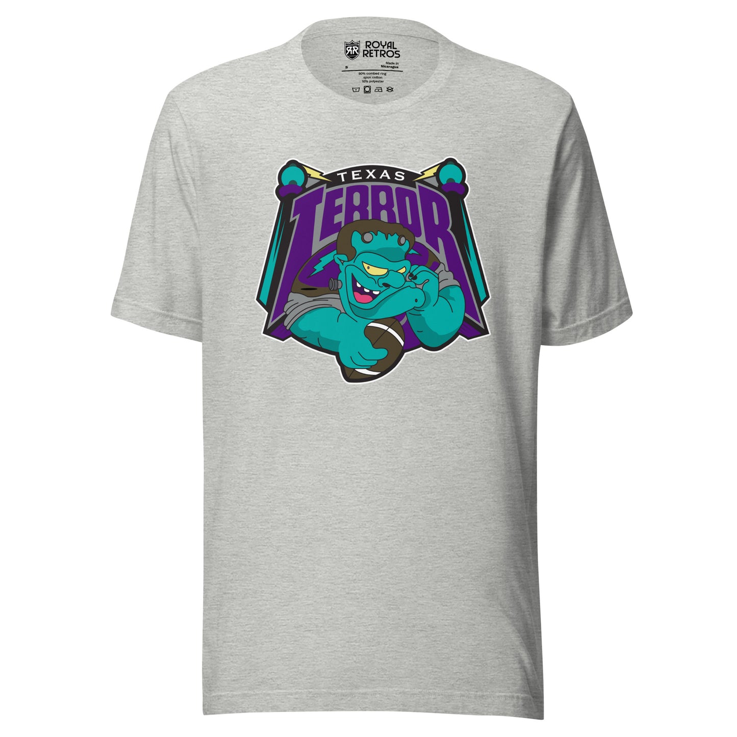 Texas Terror Arena Football League T-shirt. Athletic Gray. Texas small in white above purple, large Terror, with T and R extending down. Terror is above a cartoon Frankenstein from the shoulders up, open-mouth grin and holding a football in his right hand. Orbs on sticks on either side of logo. Royal Retros