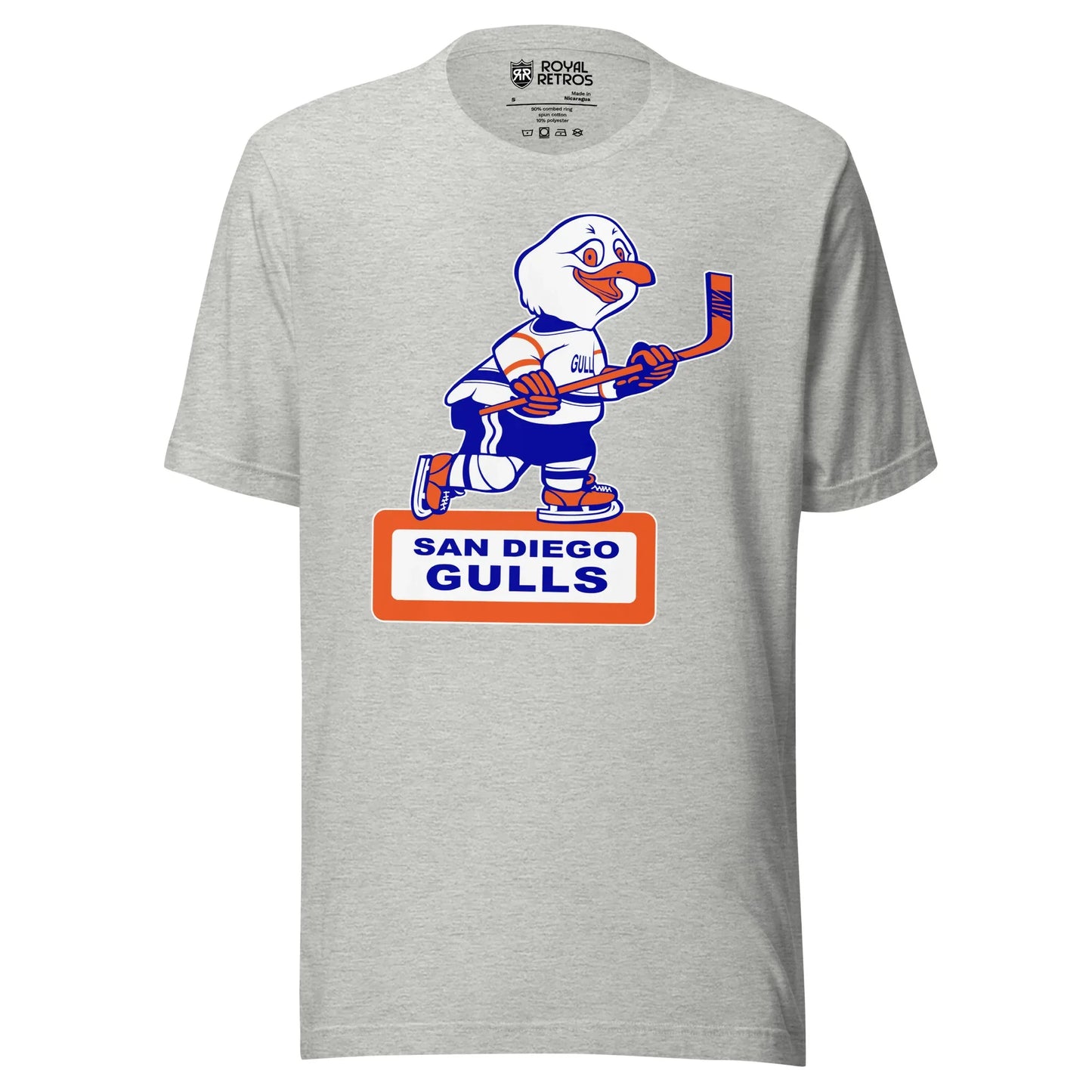 San Diego Gulls T-shirt. Gray. Animated Gull, white with blue and orange trim, skating and holding a hockey stick. Orange box underneath with white background. San Diego in blue above Gulls larger in rectangle. Royal Retros