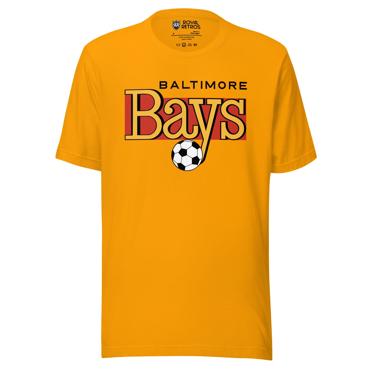 Gold Baltimore Bays T-shirt featuring the BALTIMORE wordmark in black above a gold-and-red Bays script logo and a black-and-white soccer ball