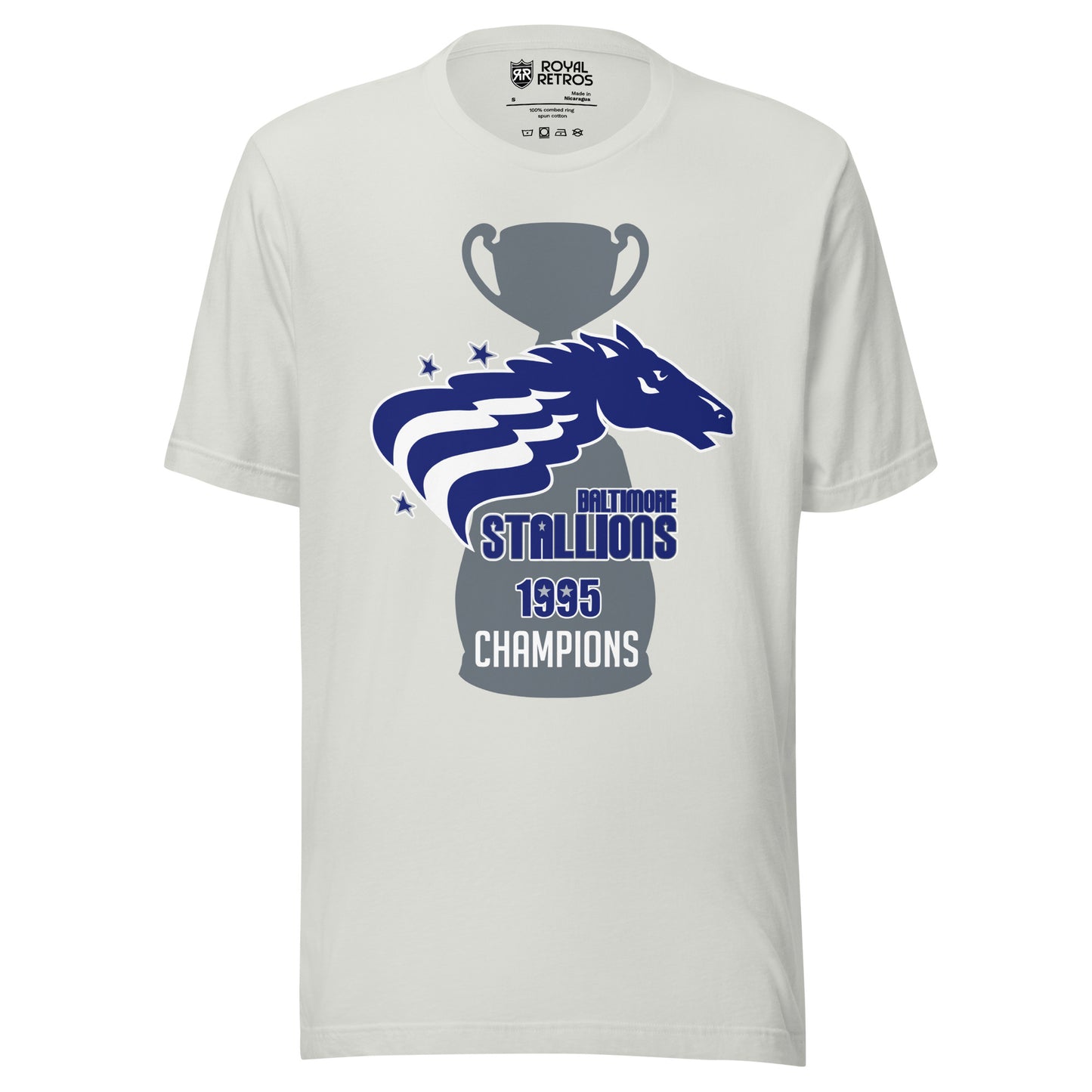 Baltimore Stallions Championship T-short. Silver. Large gray trophy with large base. Over top is a horses head in blue facing right. Two white wavy stripes from its mane. Two blue stars upper left, one lower left. Baltimore below right in blue. Stallions in blue big below. 1995 below in blue. Champions in white below that. Royal Retros