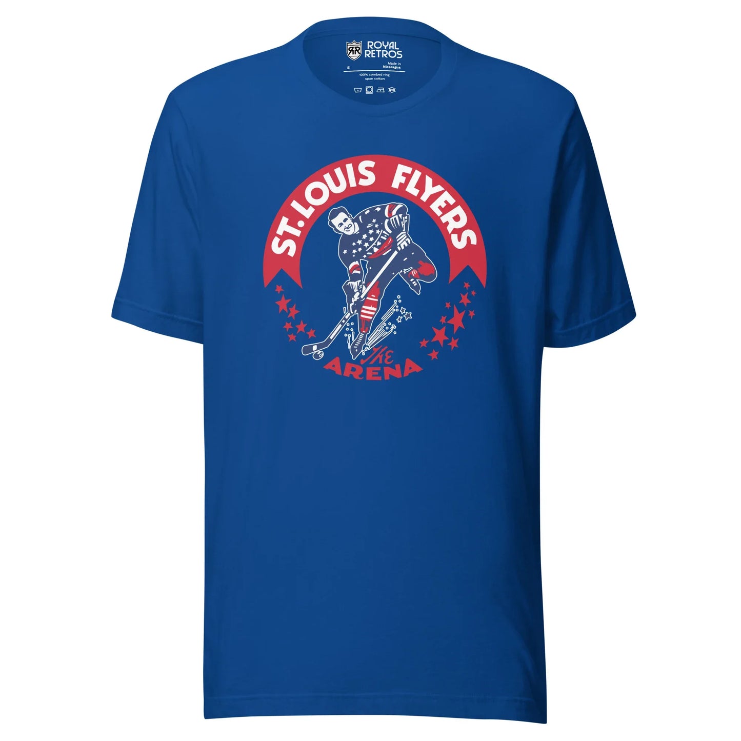 St. Louis Flyers T-shirt. Royal Blue. Red banner arched on chest. St. Louis Flyers in whit inside. Player skating toward viewer in red, white, and blue uniform, about to shoot puck. Red stars on either side below ends of banner. "The Arena" in red at bottom of logo. Royal Retros