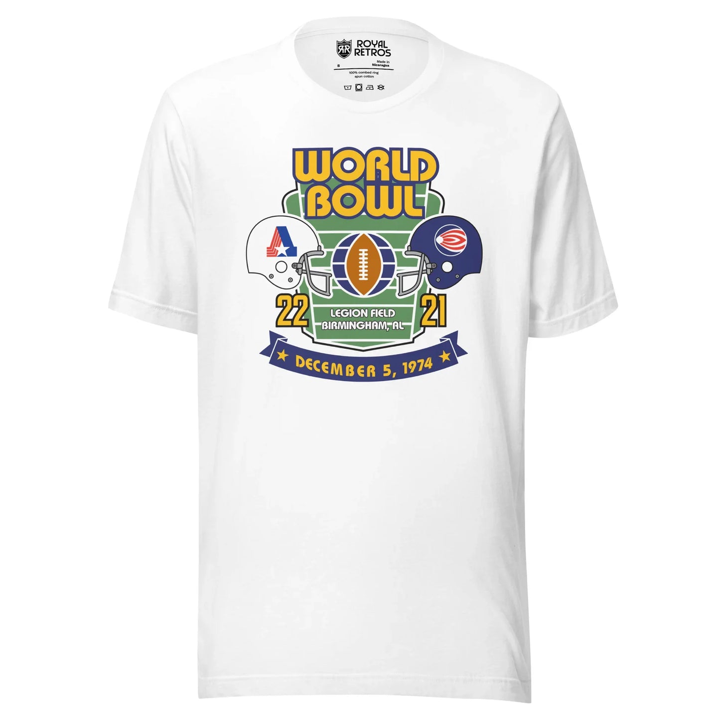 World Football League World Bowl T-shirt. White. World in Gold above Bowl in Gold over top of vertical football field. White helmet to left with A formed by red stripes on left, blue bar on right, star at bottom. On the right, blue helmet with white dot with white and red stripes leading a way. between helmets is a football vertical with partial globe quarters on blue on wither side. 22 in gold below white helmet. 21 in gold below blue helmet. Between numbers on bottom of football field Legion Field.