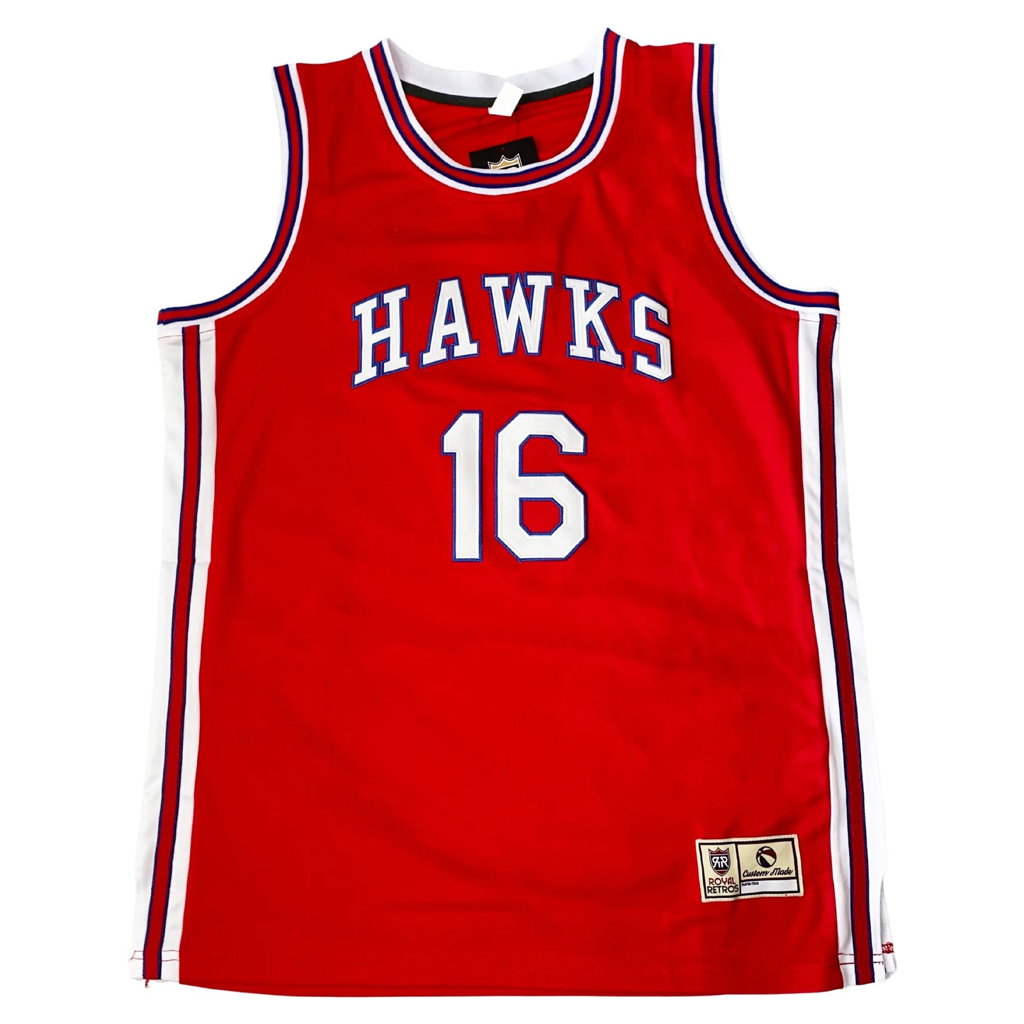 St. Louis Hawks basketball jersey. Red. Hawks in block letters, white with blue trim, arched across chest. #16 below in white with blue rim. Red, white and blue trim up sides, around shoulders and neck. Royal Retros
