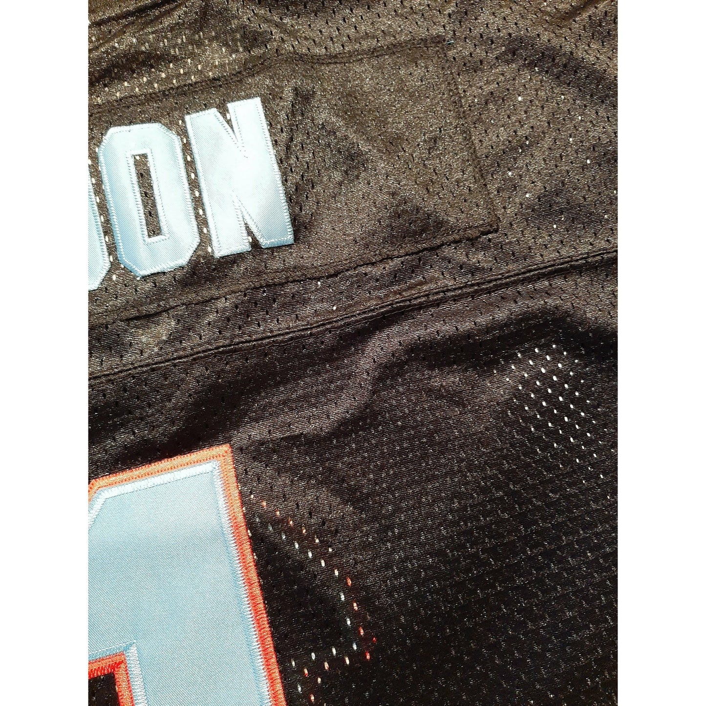 Black mesh Oil Rush Jersey, a vintage hockey jersey individually handmade for performance