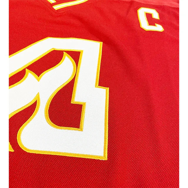 Atlanta Flames Jersey red captain's jersey close-up white flaming A trimmed in gold Royal Retros