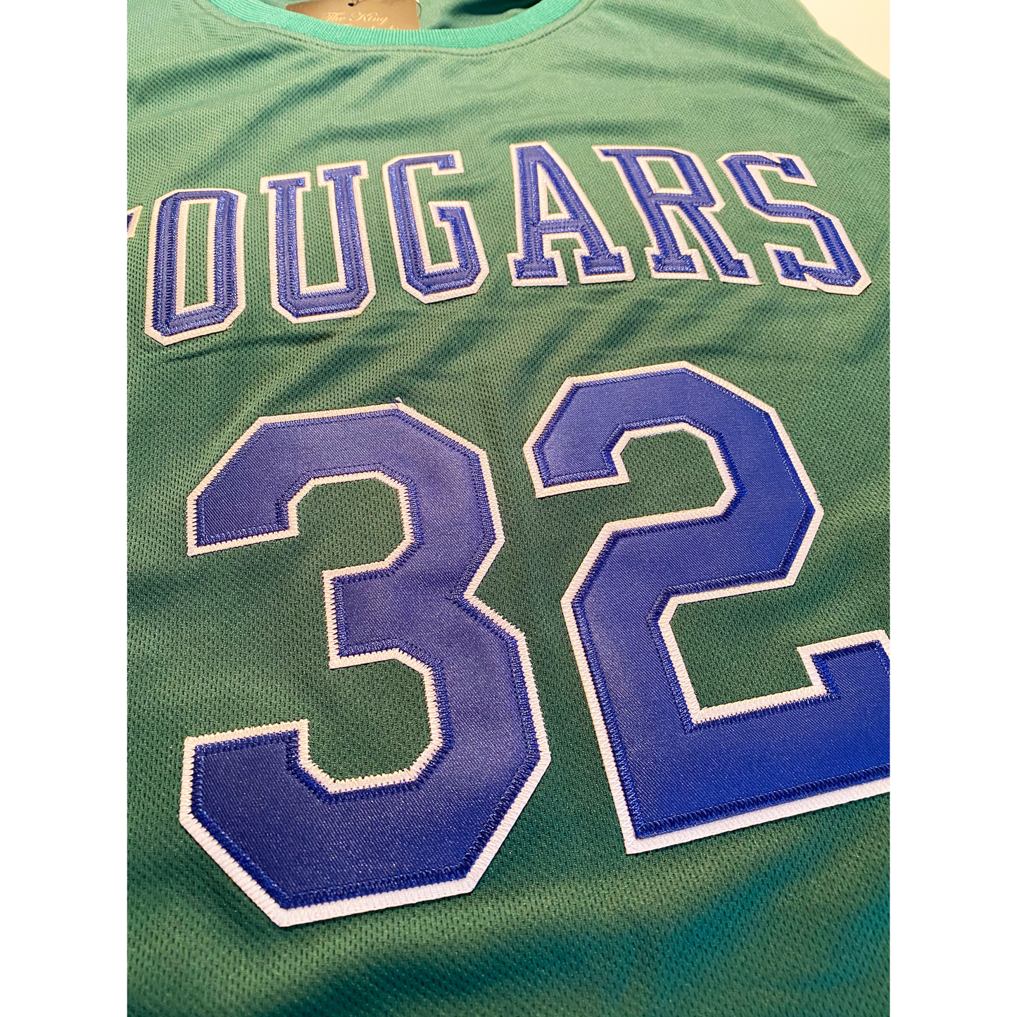 Green Carolina Cougars jersey featuring number 32, inspired by Larry Brown’s legacy