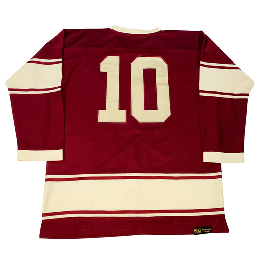 Montreal Maroons Jersey maroon. Back Thin white, thin maroon, thick white, thin maroon, thin white band around mid-sleeve and just above waist. White trim on neck. Large white #10 on chest. Royal