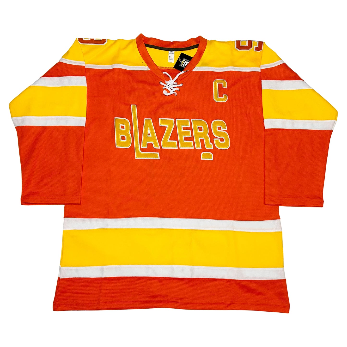 Philadelphia Blazers Jersey. Orange. Gold shoulders with white trim. White, gold, and white bands mid-sleeve and just above waist. Captains C in orange with white trim. BLAZERS in gold with white trim. L forming hockey stick. Gold puck with white trim below R. Royal Retros
