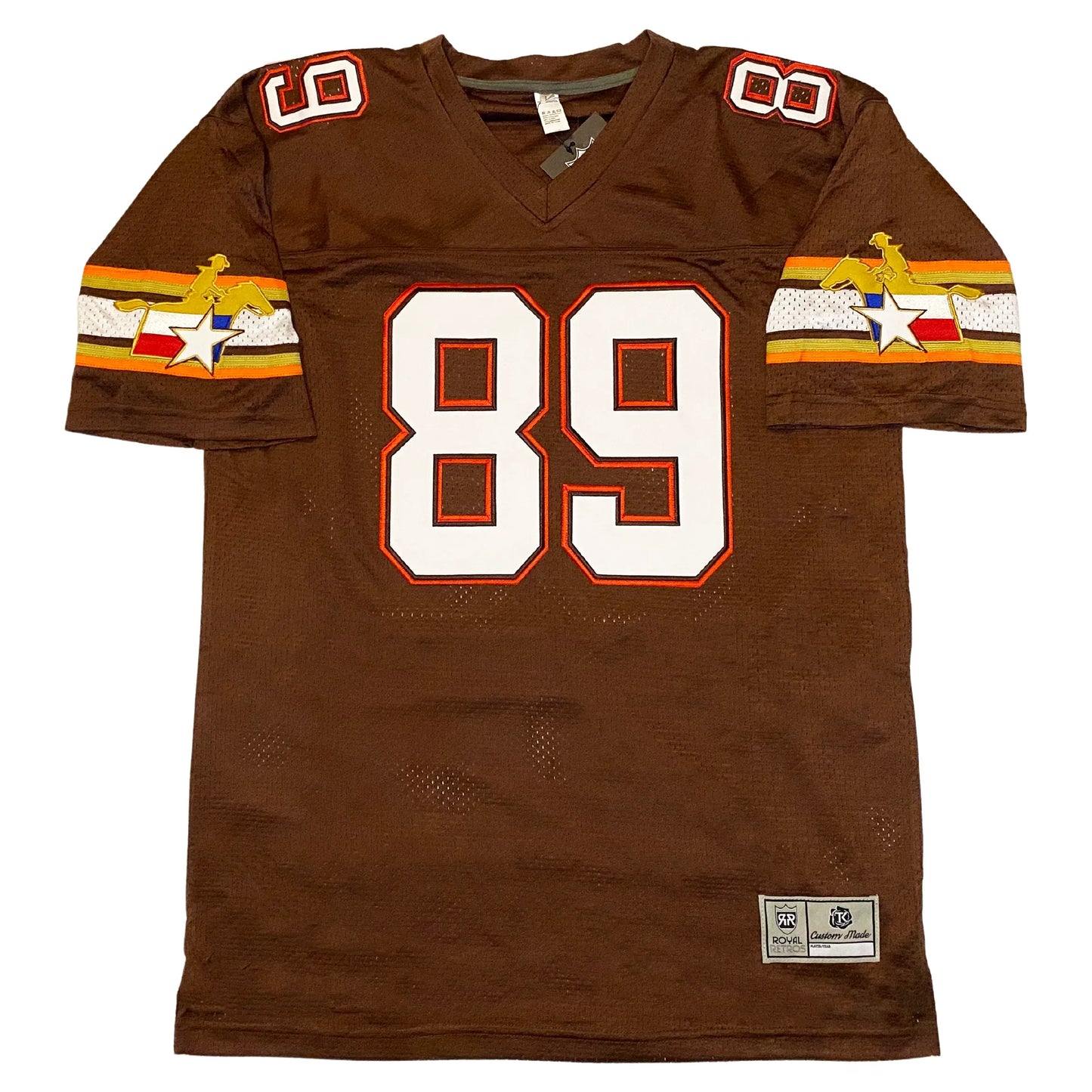 San Antonio Riders Jersey brown, Orange gold, brown, white, brown, gold, orange bands at mid-sleeve. Rider logo over bands which is a golden horse rider above Texas flag. #89 in white with red trim large on chest, small on shoulders. Royal Retros