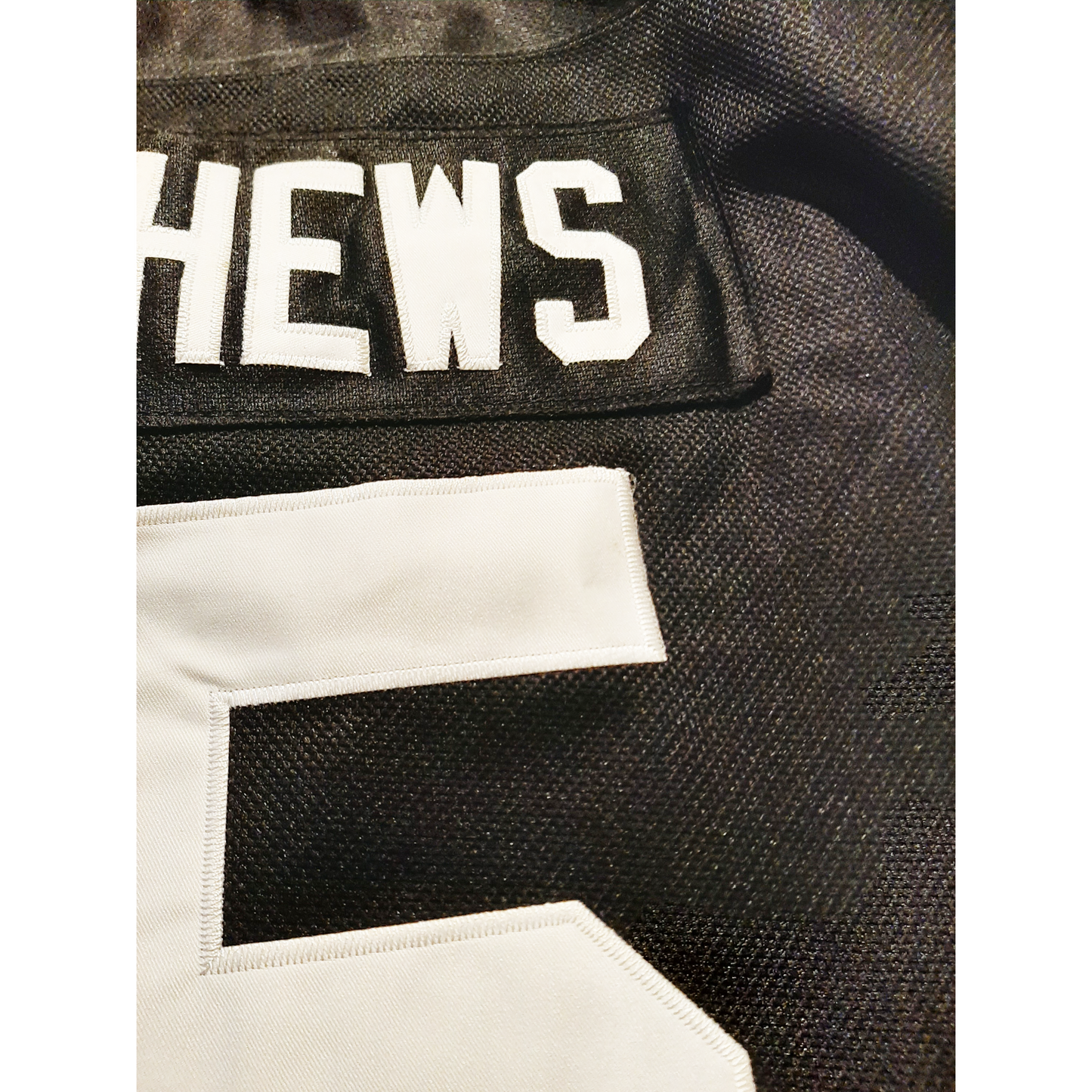 San Francisco Seals Hockey Jersey close up of number 5 on black jersey. Royal Retros