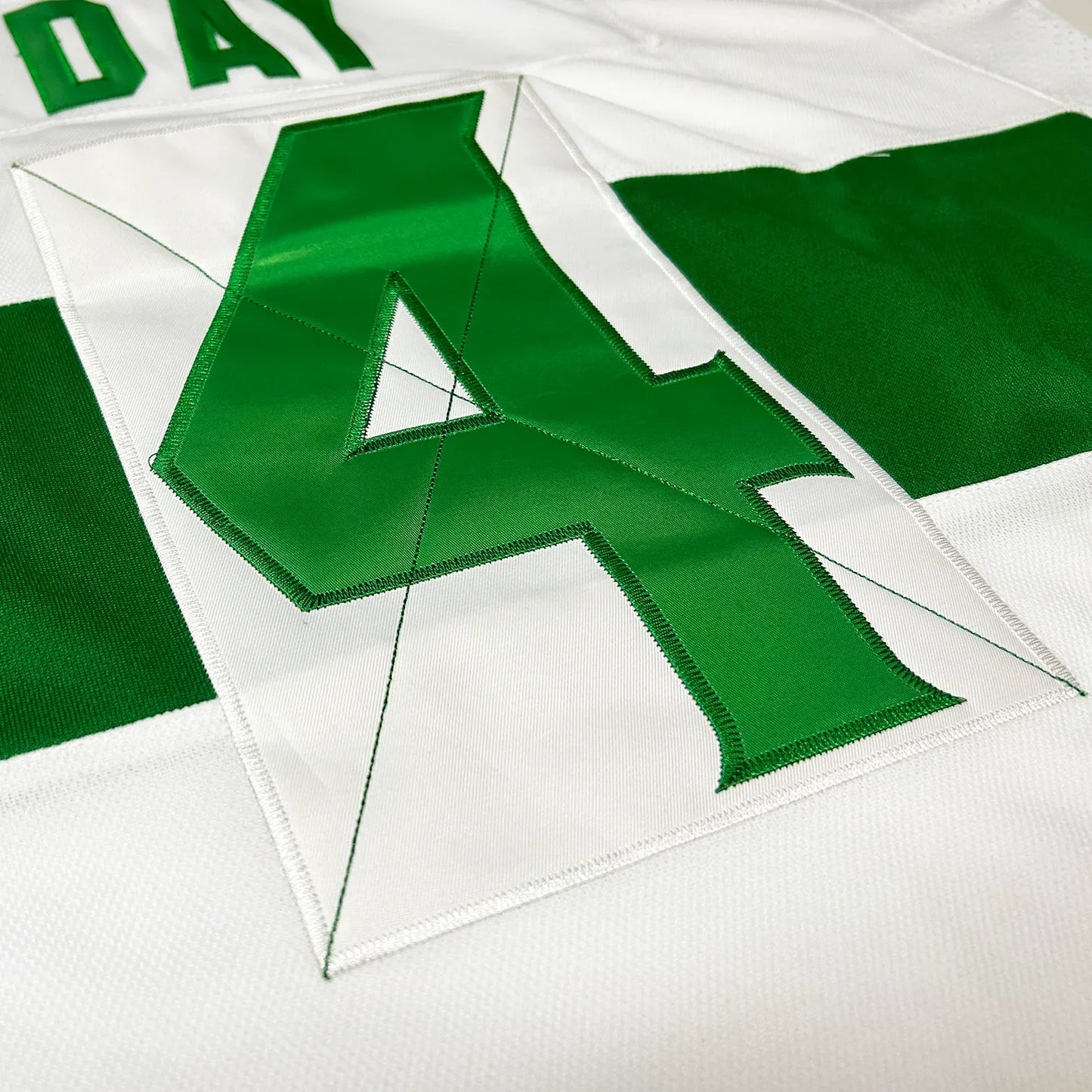 Toronto St Patricks Jersey close up of green number 4 on white jersey. Royal Retros