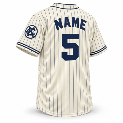 1924 Kansas City Monarchs NLB jersey cream back mockup with navy pinstripes, solid navy block NAME and number 5 and circled KC sleeve logo