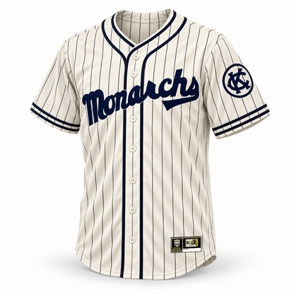 1924 Kansas City Monarchs NLB jersey cream front mockup with navy pinstripes, Monarchs script, circled KC sleeve logo, crossover piping and original NLB jock tag