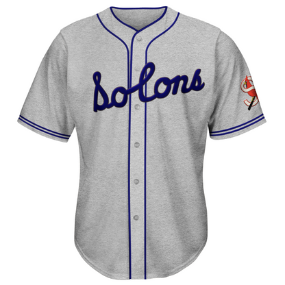 1940 Sacramento Solons button-up jersey gray. Two blue stripes at sleeve ends. Blue piping around neck and down front. Solons script in blue across chest. S logo on left sleeve Royal Retros. 