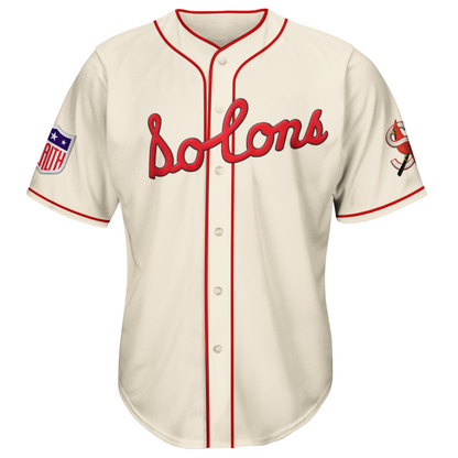 1943 Sacramento Solons button-up jersey. Red trim around sleeve ends, around neck and down front. Solons script in red across chest. Solons S logo on sleeve. Royal Retros
