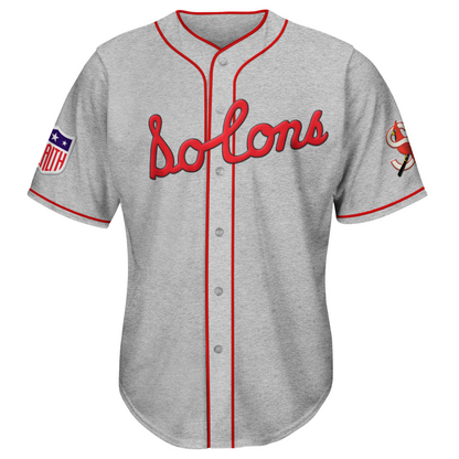 1940 Sacramento Solons button-up jersey gray. One red stripe at sleeve ends. Red piping around neck and down front. Solons script in red across chest. S logo on left sleeve Royal Retros. 