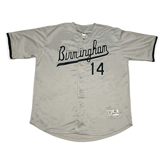 Birmingham Barons button-up baseball jersey. Gray. BIRMINGHAM in cursive, black with white trim and text tail coming off M. #14 lower right, black with white trim. Black trim on sleeve ends. Royal Retros