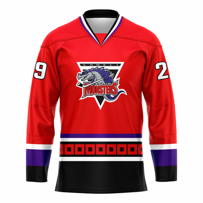 Lowell Lock Monsters hockey jersey. Red. Purple, white, and black collar. White, purple, and black bands at sleeve ends. Purple and white band at waist. Black band below with red squares, white band and large black band below. Logo is an upside down triangle, Lowell in white with black background at top. Purple and great dragon with hockey stick over MONSTERS in red. Royal Retros. 