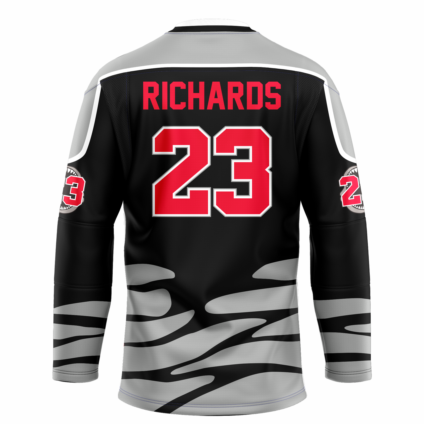 Tallahassee Tiger Sharks hockey jersey. Black. Black and white collar, silver shoulders with white trim. Random silver patter at sleeve ends and around waist suggesting ocean waves. RICHARDS in red above #23 in red with white trim large on back. Royal Retros