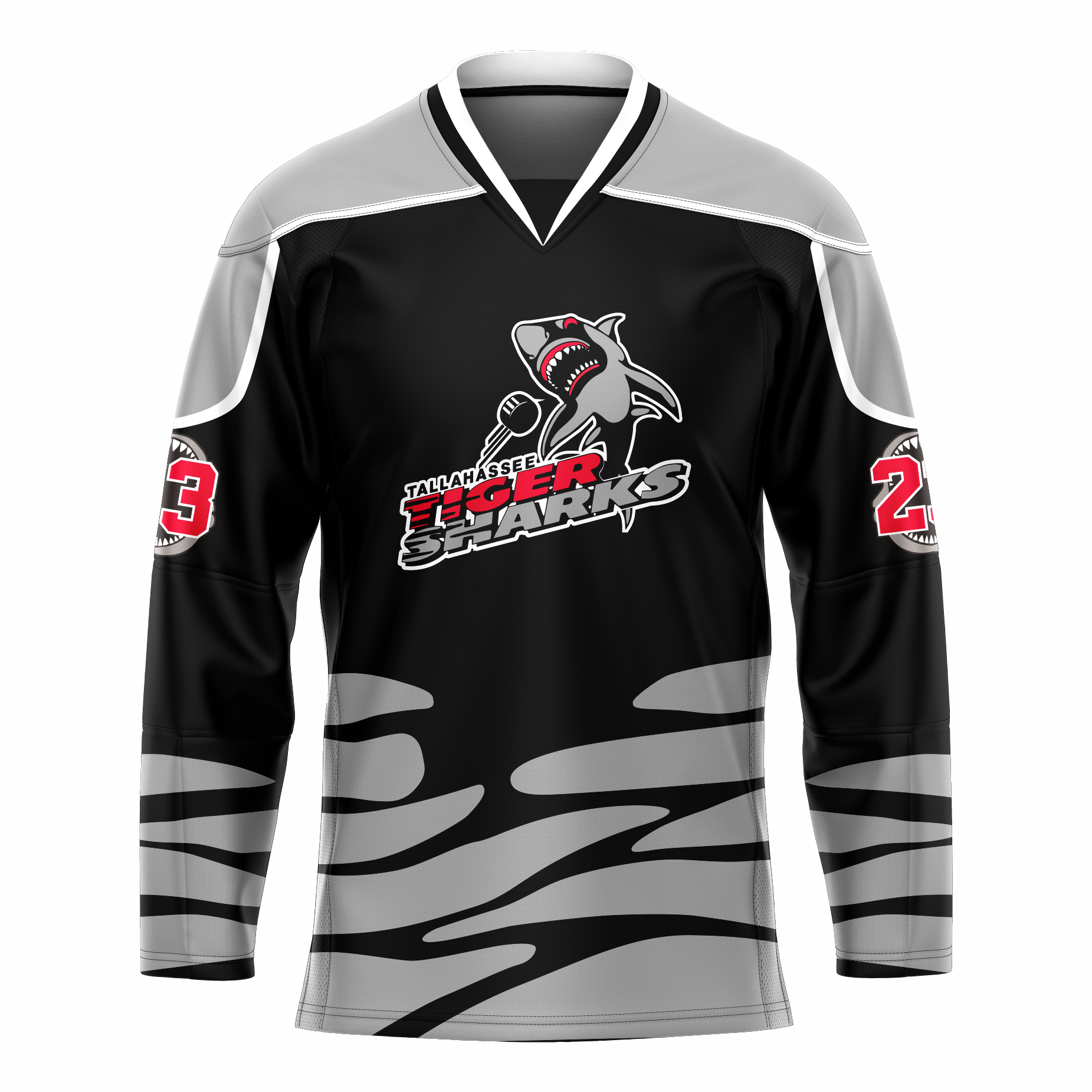 Tallahassee Tiger Sharks hockey jersey. Black. Black and white collar, silver shoulders with white trim. Random silver pattern at sleeve ends and around waist suggesting ocean waves. Logo is a shark swimming toward viewer with Tallahassee small in black with white trim above Tiger  in red and Sharks in silver. Royal Retros