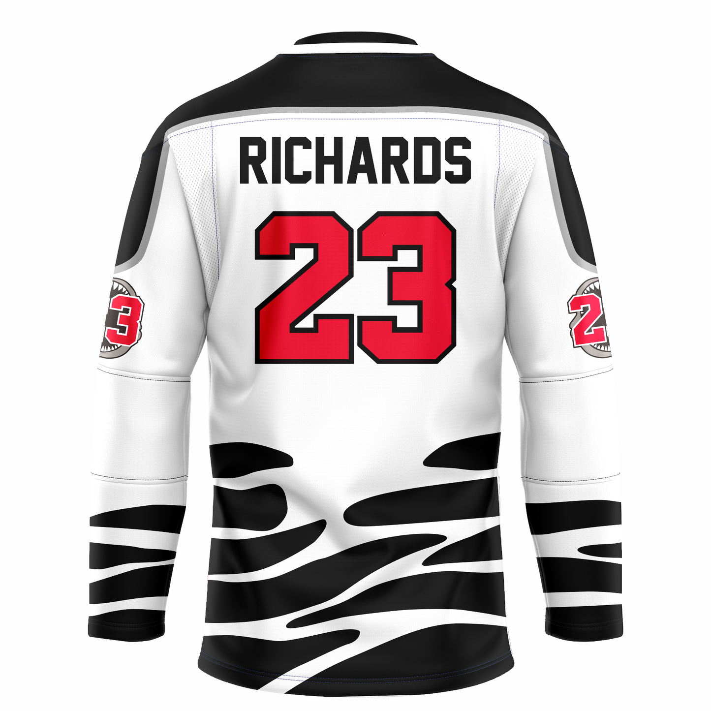 Tallahassee Tiger Sharks hockey jersey. White. Black and white collar, black shoulders with silver trim. Random black pattern at sleeve ends and around waist suggesting ocean waves. RICHARDS in red above #23 in red with white trim large on back.  Royal Retros