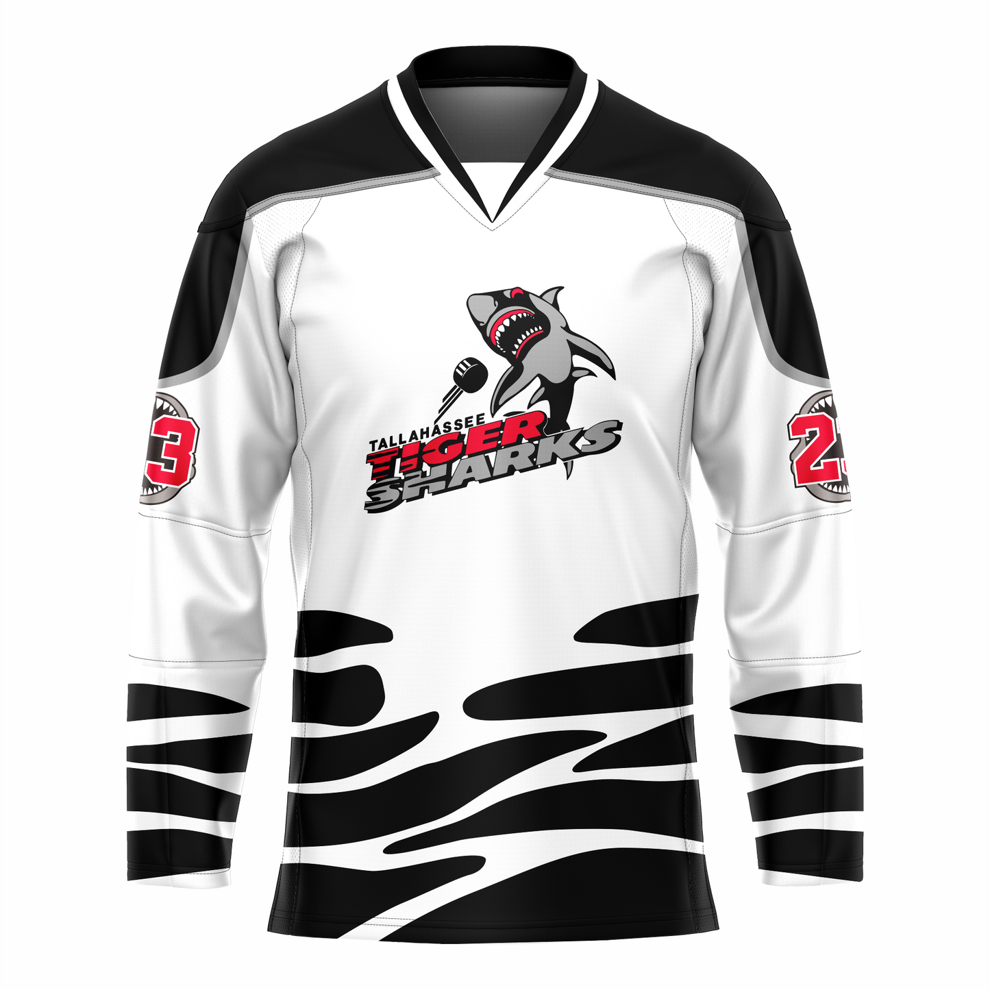 Tallahassee Tiger Sharks hockey jersey. White. Black and white collar, black shoulders with silver trim. Random black pattern at sleeve ends and around waist suggesting ocean waves. Logo is a shark swimming toward viewer with Tallahassee small in black with white trim above Tiger  in red and Sharks in silver. Royal Retros