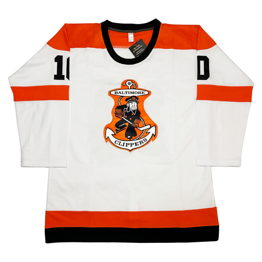 Baltimore Hockey Clippers Jersey jersey white, Orange shoulders, Orange bands on middle of sleeves. Orange and black bands around waist. Clippers logo on chest consisting of an anchor on orange background, with a ship's captain in black and white holding a hockey stick. Baltimore above, clippers below on anchor. Royal Retros