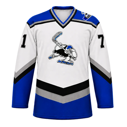 B.C. Icemen hockey jersey front in white with royal blue shoulders and lower body, black and grey chevron striping, and the cartoon penguin mascot crest at center chest