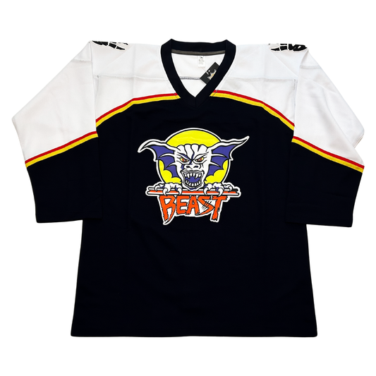 Beast of New Haven Jersey black with white shoulders. Red and gold band between white and black parts of jersey. Beast logo in center. Yellow circle with demon face with purple ears. Beast on red underneath Royal Retros