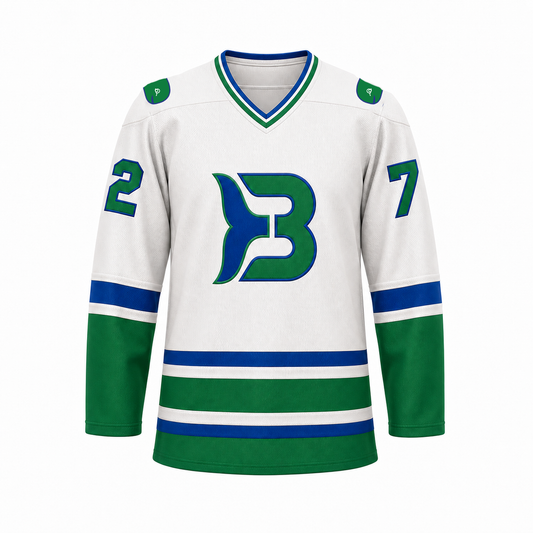 Binghamton Whalers hockey jersey front in white with blue and green sleeve and hem stripes, green cuffs and hem, and the whale-tail B crest at center chest