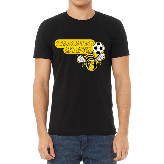 Chicago Sting T-shirt black. "Chicago" slightly over "Sting" to the left. Black and white soccer ball to the right with angry cartoon be with white wings below. Royal Retros. 