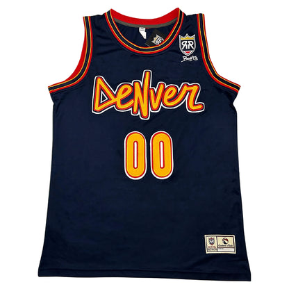 Boots X RR Denver Basketball Jersey. Navy sleeveless tank. DeNver in a hand-drawn gold script with red and white outline across the chest. #00 in gold with red and white outline below. Layered red, gold and navy rib trim at the neck and armholes. Royal Retros shield and a Boots signature on the right chest. Royal Retros