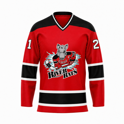 Albany River Rats hockey jersey front in red with black shoulders, black and white sleeve and hem stripes, and the rat mascot crest with River Rats wordmark at center chest