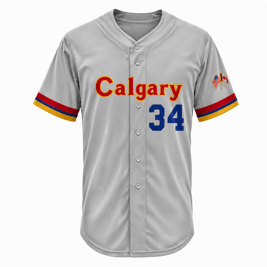 Calgary Cannons road baseball jersey in gray with a button front, Calgary across the chest in red with gold outline, blue number 34, red, blue and gold striped sleeve cuffs, and a crossed US and Canadian flag patch on the right sleeve