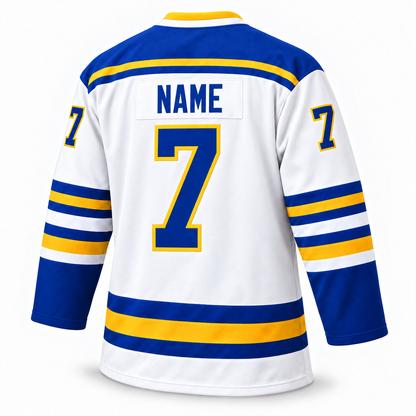 Back of the white Flint Generals hockey jersey with a blue "NAME" nameplate and blue number 7 outlined in gold.