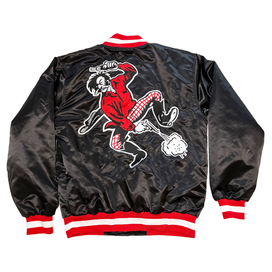 Kezar Satin Jacket - Black Large on back: Prospector in red shirt and white and red checkered pants firing a pistol down between his legs while holding another pistol in his left hand over his head. Collar and sleeve ends are red, white, and red. Royal Retros