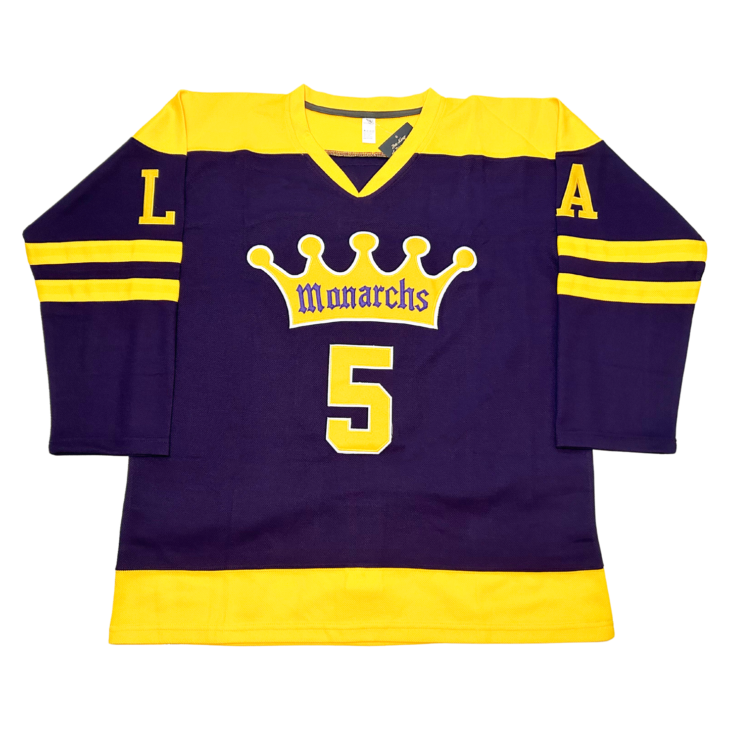 Los Angeles Monarchs hockey jersey. Navy blue with yellow shoulders. Two gold bands mid-sleeve. Yellow crown with five points, Monarchs in blue with white trim in bottom of crown. #5 in yellow below. Gold band around waist. LA in  yellow on upper sleeves. Royal Retros