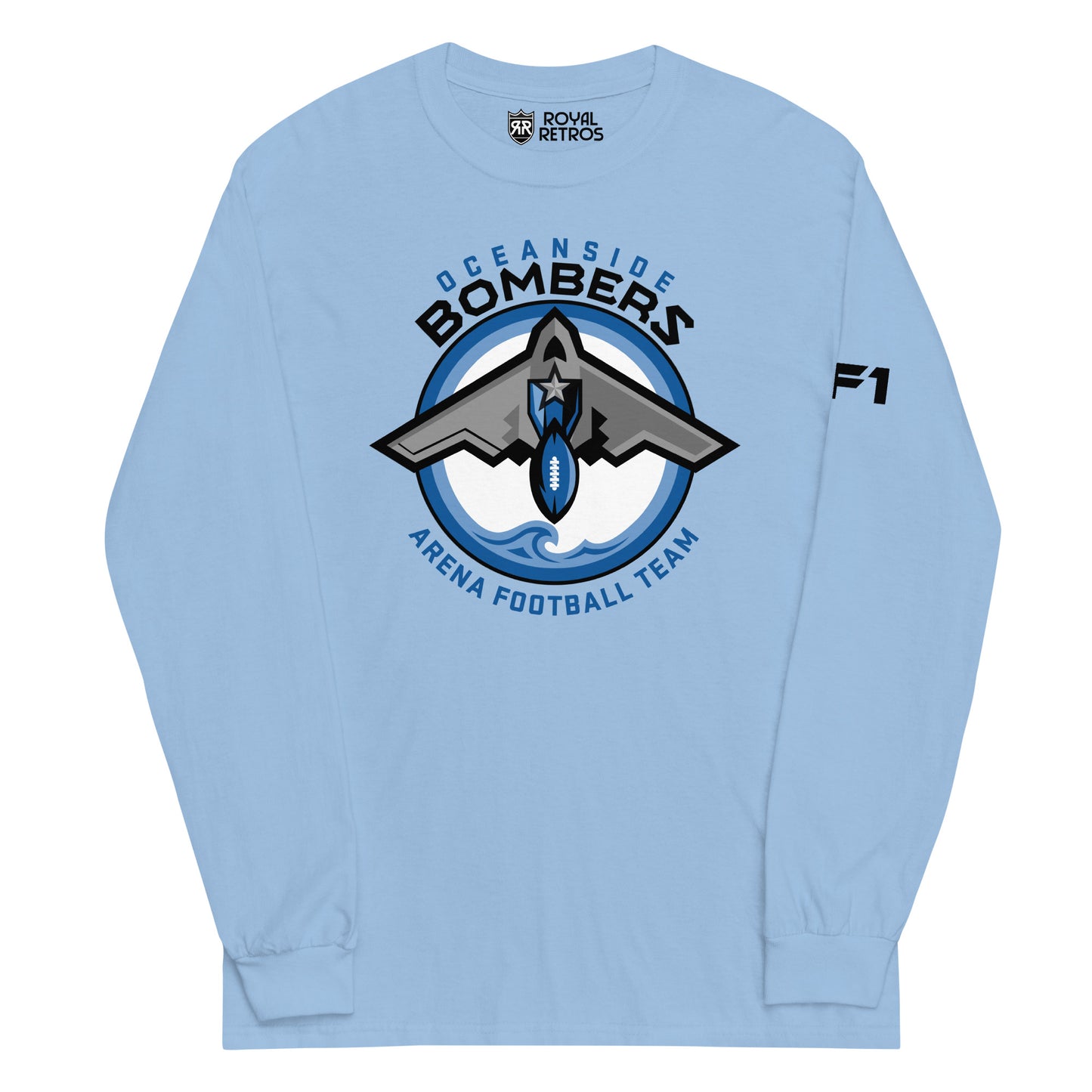 Oceanside Bombers football long sleeve T-shirt. Carolina Blue. Oceanside in blue arched above Bombers slightly larger in black over a circle outlined in black and two slightly larger rings, blue and light blue inside. White background. B-2 bomber from the top over the circle with wings slightly protruding. A football coming off the tail. An ocean wave appears in the bottom of the circle. Outside the circle arched below is Arena Football team arched up in blue. Royal Retros