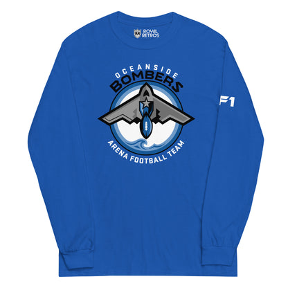 Oceanside Bombers football long sleeve T-shirt. Royal blue. Oceanside in white arched above Bombers slightly larger in black over a circle outlined in black and two slightly larger rings, blue and light blue inside. White background. B-2 bomber from the top over the circle with wings slightly protruding. A football coming off the tail. An ocean wave appears in the bottom of the circle. Outside the circle arched below is Arena Football team arched up in white. Royal Retros