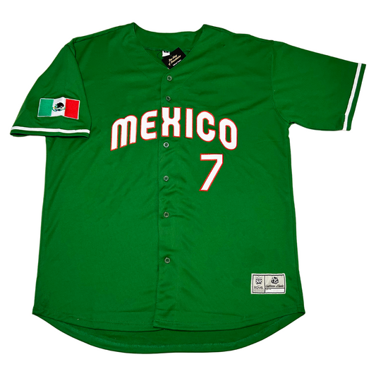 Mexico Baseball button-up jersey green.  Mexico in white lettering with red trim arched across chest. #7 in white with red trim below right.  Mexican flag on right sleeve. White ring just above sleeve ends. Royal Retros