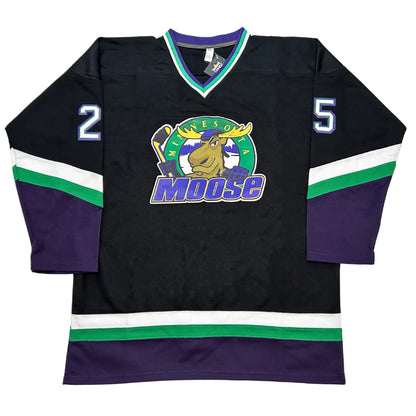 Minnesota Moose Jersey. Navy. White and green bands at an angle mid-sleeve with purple bottom half of sleeves and above waist. #25 white with purple trim on sleeves. Purple, green, and white collar. Moose logo of moose holding hockey stick over green circle with yellow Minnesota and MOOSE in purple with yellow trim across and over bottom of circle. Royal Retros
