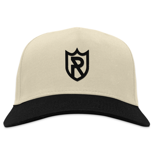 Royal Retros cream snapback hat. White with black bill. Shield outlined in black, with R in center. Royal Retros